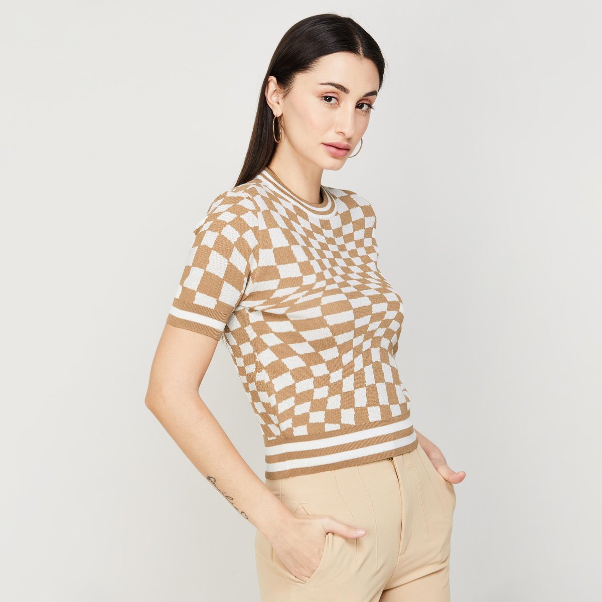 Chic Checkered Knit Top with Beige Slim-Fit Trousers