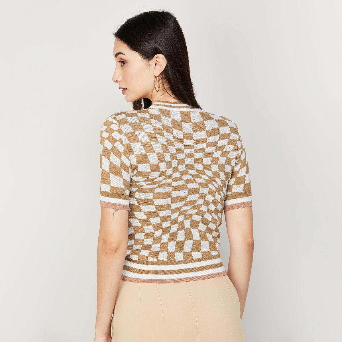 Chic Checkered Knit Top with Beige Slim-Fit Trousers